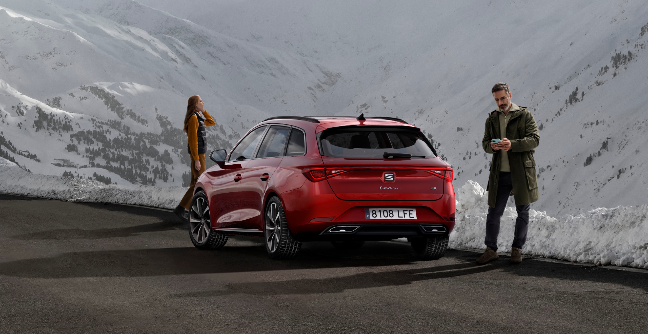 Rear view of SEAT Leon hatchback car driving through countryside – SEAT Roadside assistance owners services